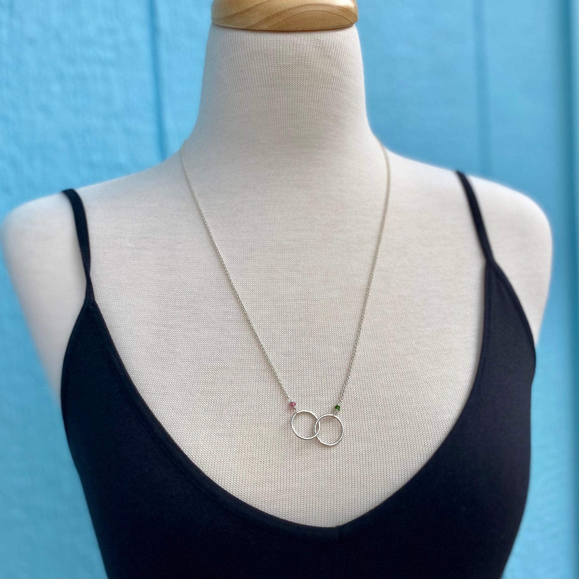 small connected circles necklace with gemstones