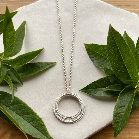 sterling silver 70th birthday milestone necklace with 7 rings 7 decades