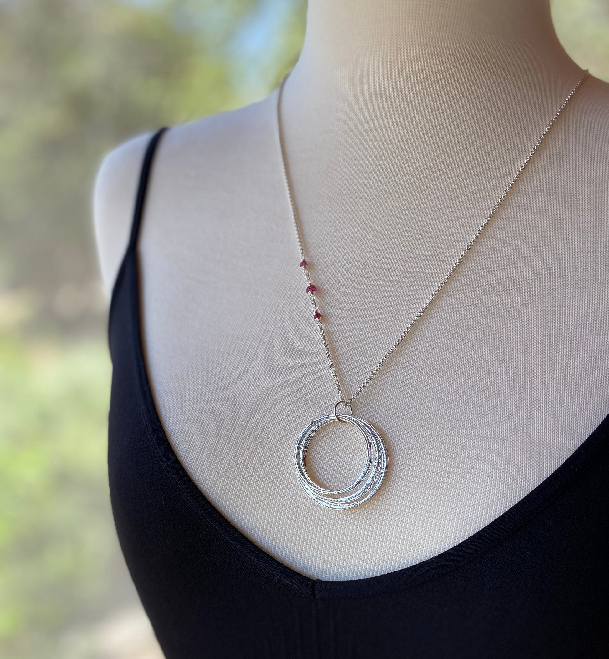 70th Birthday Milestone Necklace with Birthstones, Bold Handcrafted Sterling Silver Sparkly Circles Seven Rings for 7 Decades Pendant